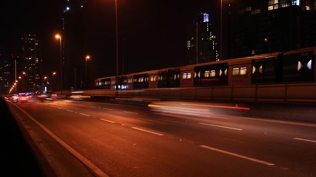 Traffic in city at night with car speed.