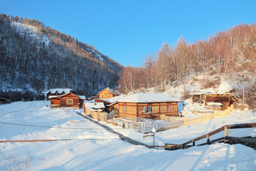 Siberian village in the mountains, winter landscape