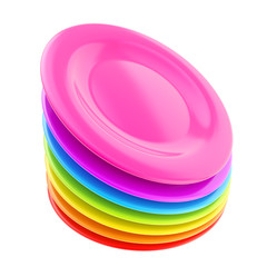 Stack of colorful plate dishes isolated on white