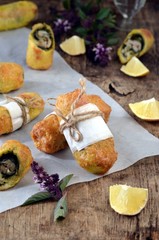 Fried rolls with fish and pesto sauce