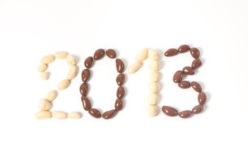 2013 with chocolate candies, on white