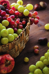 Wicker basket with autumn fruits