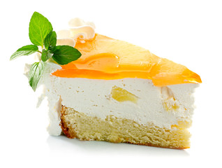 Piece of pineapple cake cream and mint leaves iaolated
