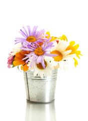 beautiful bouquet of bright wildflowers in bucket, isolated