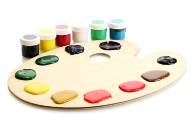 wooden art palette and banks  with paint isolated on white