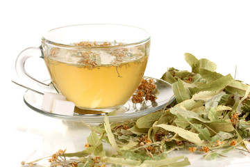 Glass cup of tea with linden isolated on white