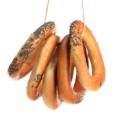 tasty bagels on rope, isolated on white