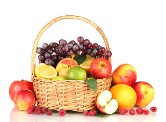 Assortment of exotic fruits in basket, isolated on white