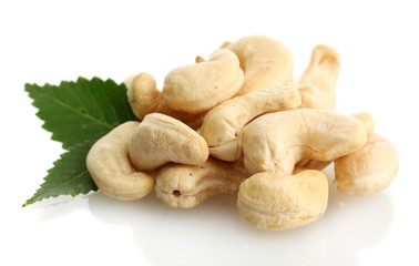 tasty cashew nuts with leaves, isolated on white