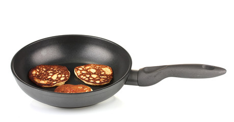 delicious sweet pancakes in frying pan isolated on white