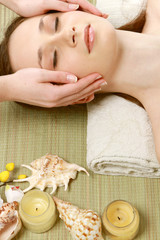 Obraz na płótnie Canvas Beautiful young woman getting spa massage