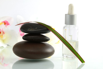 A stack of black stones and spa objects