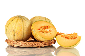 cut melon on wicker mat isolated on white