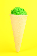 Scoop of the kiwi ice cream in the waffle cone