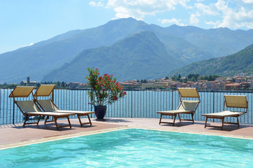 Sunbeds against Como lake, Italy
