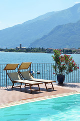 Sunbeds against Como lake, Italy