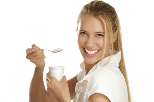 Young Woman Eating Yogurt