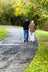 Old family walking in park