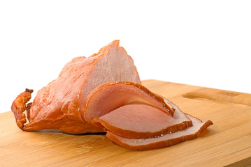 Thinly sliced ham on a cutting board