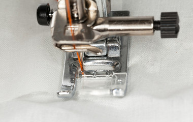 Metal foot of sewing machine on clothing