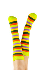 female legs in colorful striped socks