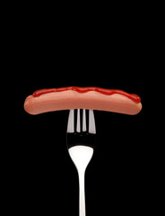 frankfurter sausage on fork