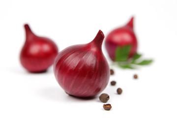 Red onion tuber and fresh parsley isolated on white background