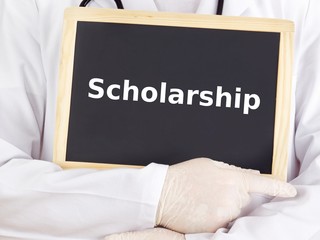 Doctor shows information on blackboard: scholarship