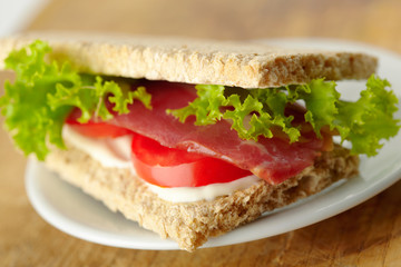 Homemade sandwich with bacon
