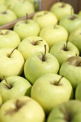Appetizing green apples in supermarket