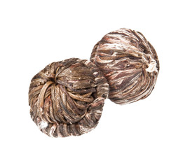 green chinese tea balls on white background 