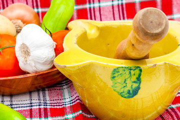 Mortar, pestle, fruits and vegetables