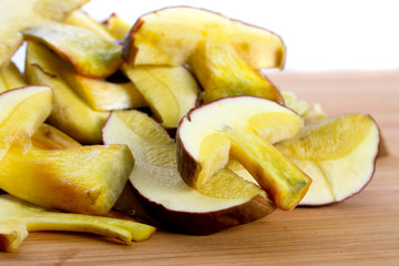 Cutted forest mushrooms on the wooden board
