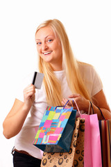 Happy blonde woman with purchases and discount card