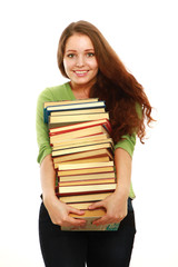 A smiling woman holding books, isolated on white