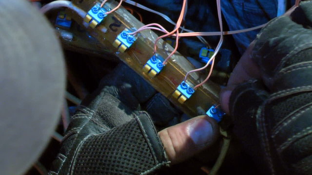 A man fixing remote control on a pyrotechnical plant.