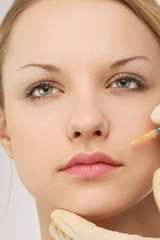 A cosmetic injection of botox to the face - close-up portrait