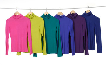 colorful clothing on hanger rack display