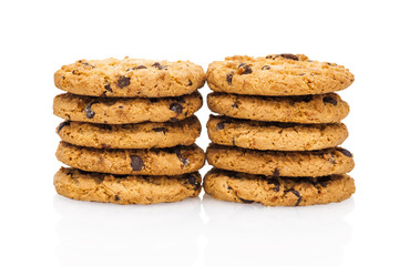 A stacks of chocolate chip cookies isolated on a white backgroun