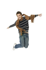 Isolated Attractive male jumping wearing scarf
