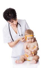 beautiful doctor and baby on a white background. Doctor measures