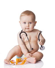 Sweet baby with stethoscope and measure tape on a white backgrou