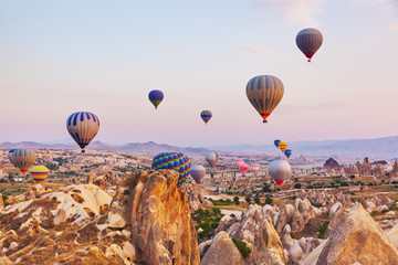 Hot air balloon flying over Cappadocia Turkey - obrazy, fototapety, plakaty