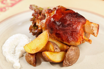roasted pork knuckle with potatoes