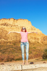 Fototapeta premium girl at a mountain foot