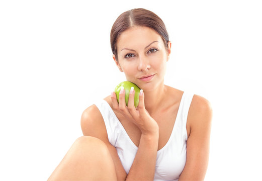 Pretty woman with apple on white background
