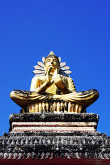 Buddha on a temple door and the sky 1