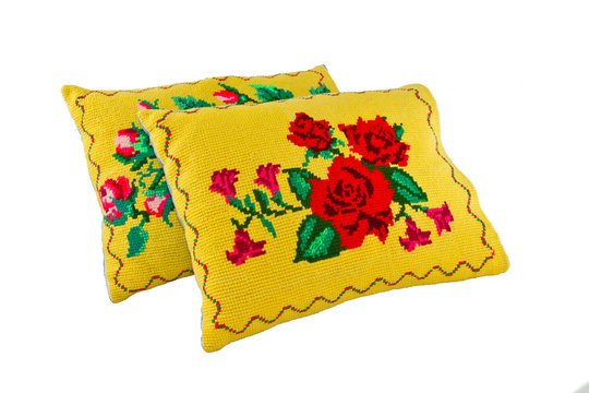 a pillows with a pattern of colored threads embroidered