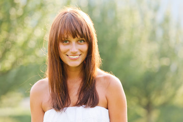 Naklejka premium Summer portrait of young smiling woman