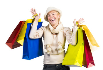 Beautiful woman carrying a lot of colorful shopping bags